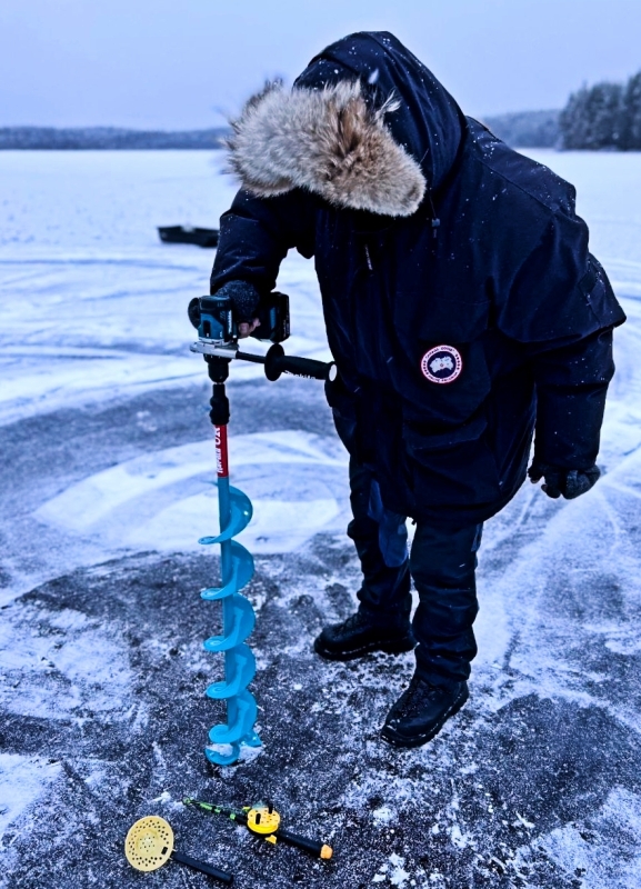 Ice Fishing on a Frozen Lake in Rovaniemi, Lapland 3
